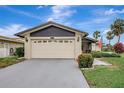 Home's exterior shows a two-car garage, manicured landscaping, and an American flag at 4512 Superior Ln, Clearwater, FL 33762