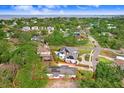 Property's aerial view highlights its location near the coast and lush surrounding landscape at 4640 W Lamb Ave, Tampa, FL 33629