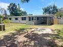 Charming single-story home with a well-maintained lawn and covered parking at 4722 Harris Ave, Sarasota, FL 34233