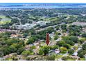 Aerial view showcasing the home's location near the water and golf course at 614 12Th Nw St, Largo, FL 33770