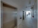 Hallway leading to elevators and other building access points at 7600 Sun Island S Dr # 603, South Pasadena, FL 33707