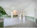 Bright and airy living room with tile flooring and sliding glass doors to outdoor living space at 8822 Misty Creek Dr, Sarasota, FL 34241