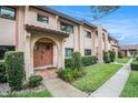 Charming two-story townhome featuring private entrances and well-maintained landscaping at 9521 86Th Ave # 9521, Seminole, FL 33777
