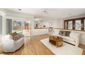 Bright living room with sliding doors leading to the pool area, offering seamless indoor-outdoor living at 115 Lake Shore E Dr, Palm Harbor, FL 34684