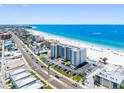 Beachfront condo building with pool, parking, and stunning beach views from multiple floors at 13500 Gulf Blvd # 507, Madeira Beach, FL 33708