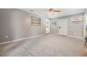 Living room with carpet and lots of light, showcasing a cozy and inviting atmosphere at 2526 W Jean St, Tampa, FL 33614