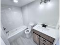 Bright bathroom featuring a vanity with modern fixtures and a shower-tub combo at 2625 State Road 590 # 1012, Clearwater, FL 33759