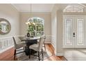Charming dining room features hardwood floors, natural light, and stylish furnishings at 2708 Coastal Range Way, Lutz, FL 33559