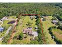Expansive estate featuring a private pool, lush greenery, and secondary buildings, all within a securely defined perimeter at 3452 Forelock Rd, Tarpon Springs, FL 34688