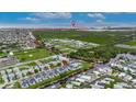 Aerial view of community, showing canal access to the ocean, nearby green spaces, and city views at 6528 Simone Shores Cir, Apollo Beach, FL 33572