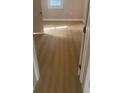 Bright bedroom featuring modern flooring, neutral paint, and natural light at 8502 Grapefruit Ave, Tampa, FL 33619