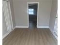 Cozy bedroom with neutral walls, updated floors, and closet storage at 8502 Grapefruit Ave, Tampa, FL 33619