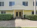Inviting entrance showcases a well-maintained walkway leading to charming front doors with elegant accents at 9731 Meadow Field Cir, Tampa, FL 33626