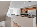 Well-lit kitchen with granite countertops and stainless steel refrigerator at 113 S Sherrill St # 113, Tampa, FL 33609