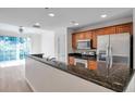 Modern kitchen with stainless steel appliances and granite countertops at 113 S Sherrill St # 113, Tampa, FL 33609