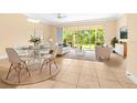 Open-concept living and dining area with large sliding glass doors that provide an abundance of natural light at 11546 52Nd E Ct, Parrish, FL 34219