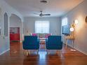 Bright living room boasts hardwood floors, modern furniture, and neutral color scheme with pops of blue at 1620 15Th N St, St Petersburg, FL 33704
