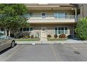 Two-story condo unit with brick facade and a cozy front garden, plus convenient parking at 2192 Swedish Dr # 10, Clearwater, FL 33763