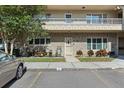 Two-story condo unit with brick facade and a cozy front garden, plus convenient parking at 2192 Swedish Dr # 10, Clearwater, FL 33763