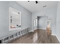 Open living room featuring beautiful wood-look floors and lots of natural light at 2320 W Walnut St, Tampa, FL 33607