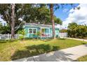 Lovely home with a brick driveway, manicured lawn, and inviting front porch at 2709 Upton S St, Gulfport, FL 33711