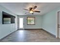 Living room with wood-look flooring, modern paint, and lots of light at 3619 15Th Se Ave, Largo, FL 33771