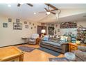 Cozy living room with vaulted ceiling, wood-look floors, and ample space for seating at 36725 Arcadia Ave, Myakka City, FL 34251