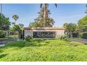 Aberdeen entrance sign surrounded by well-manicured landscaping, iron gates, and palm trees at 5029 Camberley Ln, Oldsmar, FL 34677