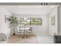 Bright dining area featuring a view of the neighborhood with ample natural light, perfect for relaxed meals at 5622 Tangerine S Ave, Gulfport, FL 33707