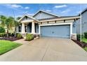 Charming single-Gathering home with well-manicured lawn and tropical landscaping at 6127 Colmar Pl, Apollo Beach, FL 33572
