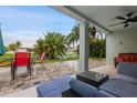 Inviting outdoor patio area, furnished with a comfortable seating, overlooking a serene waterfront view at 6416 Grenada Island Ave, Apollo Beach, FL 33572