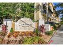 Cordoba Beach Park sign surrounded by lush tropical landscaping adds curb appeal to the condos in this sought-after community at 119 Beach Haven Ln, Tampa, FL 33609