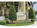 Cordoba Beach Park monument sign surrounded by flowers and manicured greenery at 125 Grand Beach Pl # 125, Tampa, FL 33609