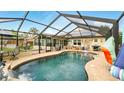 Relaxing screened-in pool area with ample seating and space for entertaining at 15348 Glossy Ibis Rd, Weeki Wachee, FL 34614