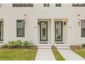 Modern townhome entrances feature glass doors, contemporary lighting, and a well-maintained lawn at 321 15Th N St, St Petersburg, FL 33705