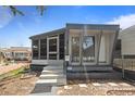 Inviting entrance with well-manicured landscaping and a cozy screened-in porch at 4851 W Gandy Blvd # B1L8, Tampa, FL 33611