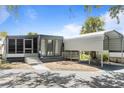 Charming single-story home with a covered carport and screened in porch at 4851 W Gandy Blvd # B1L8, Tampa, FL 33611