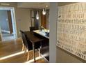The dining area includes seating for four, pendant lighting, and beach themed decor at 701 S Madison Ave # 515, Clearwater, FL 33756