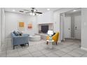 Bright living room with tile flooring, modern decor, and ample natural light at 7503 Winchester Dr, Tampa, FL 33615