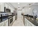 Spacious kitchen featuring stainless steel appliances, granite countertops, and ample cabinet space at 1108 N Franklin St # 502, Tampa, FL 33602