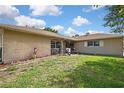 Inviting single-story home with a well-manicured lawn and front porch, perfect for enjoying the outdoors at 11187 Blythville Rd, Spring Hill, FL 34608