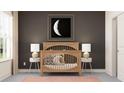 Cozy Bedroom room with soft lighting, wooden crib, and moon-themed art for a serene atmosphere at 18469 Serene Lake Loop, Lutz, FL 33548