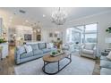 Spacious open-plan living room with a view of the kitchen and dining area at 2388 Oakwood Preserve Dr, Wesley Chapel, FL 33543