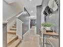 View of the hallway with carpet stairs, neutral paint, and storage solutions at 3320 Pleasant Willow Ct, Brandon, FL 33511