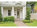 Inviting front porch with decorative lighting and a well-maintained brick walkway at 334 11Th Ne Ave, St Petersburg, FL 33701