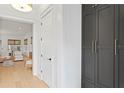 Hallway with white walls, modern black hardware and view of the living room at 334 11Th Ne Ave, St Petersburg, FL 33701