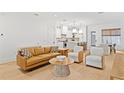 Open-concept living space featuring hardwood floors and contemporary furnishings at 334 11Th Ne Ave, St Petersburg, FL 33701