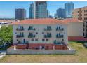 Multi-story building with balconies, rooftop and views of the city skyline at 340 1St N St # I, St Petersburg, FL 33701