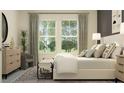 Bright bedroom with large windows, stylish furniture, and soothing color palette at 4752 Southern Valley Loop, Brooksville, FL 34601