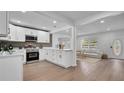 Modern kitchen featuring white cabinets, stainless steel appliances, and beautiful countertop at 603 Amana Ave, Brandon, FL 33510